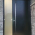 Modern Door-Modern Solid Door with side lite & transom and stainless steel handle installed in Oakville