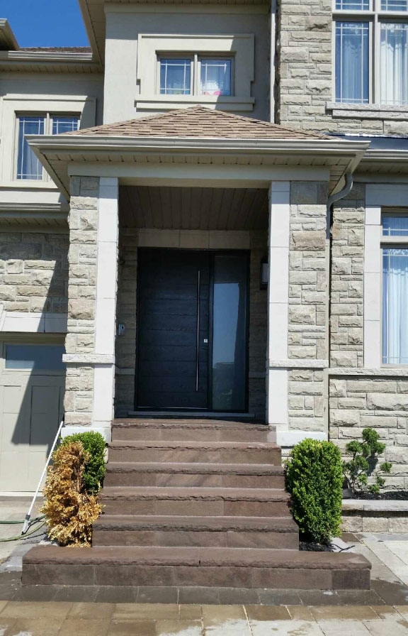 Modern Exterior Front Door-Modern Rustic Woodgrain Front Door with Stainless Steel Bar and Multi Point Locks Installed by Giant Door Manufacturers Inc