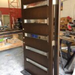 Woodgrain Modern Front Door with 5 Door Lites and Multi Point Locks by Giant Door Manufacturers Inc